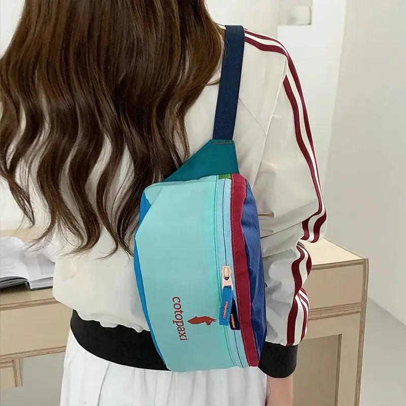 Cotopaxi waist bag crossbody; turquoise teal panels, blue strap, large capacity unisex