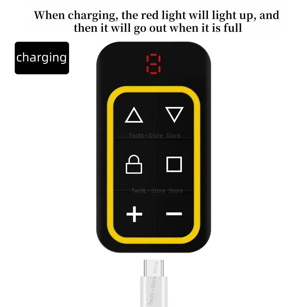 Multi-frequency 300-915MHz garage door remote duplicator with black body and yellow border; USB-C cable included.