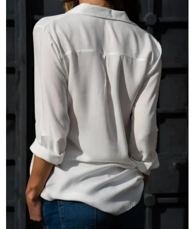 Women's white autumn blouse with polo collar and loose button-up style, back view.