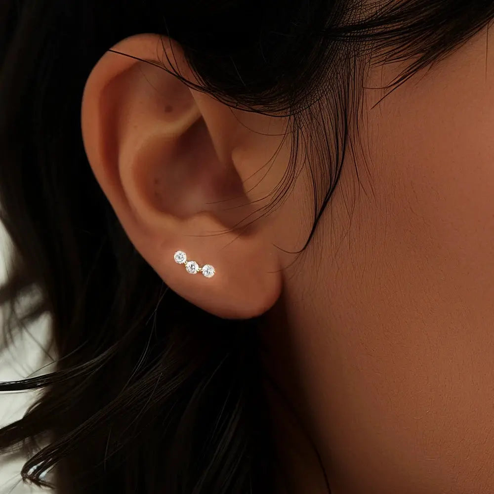 Three-stone sterling silver ear stud with clear zircon crystals