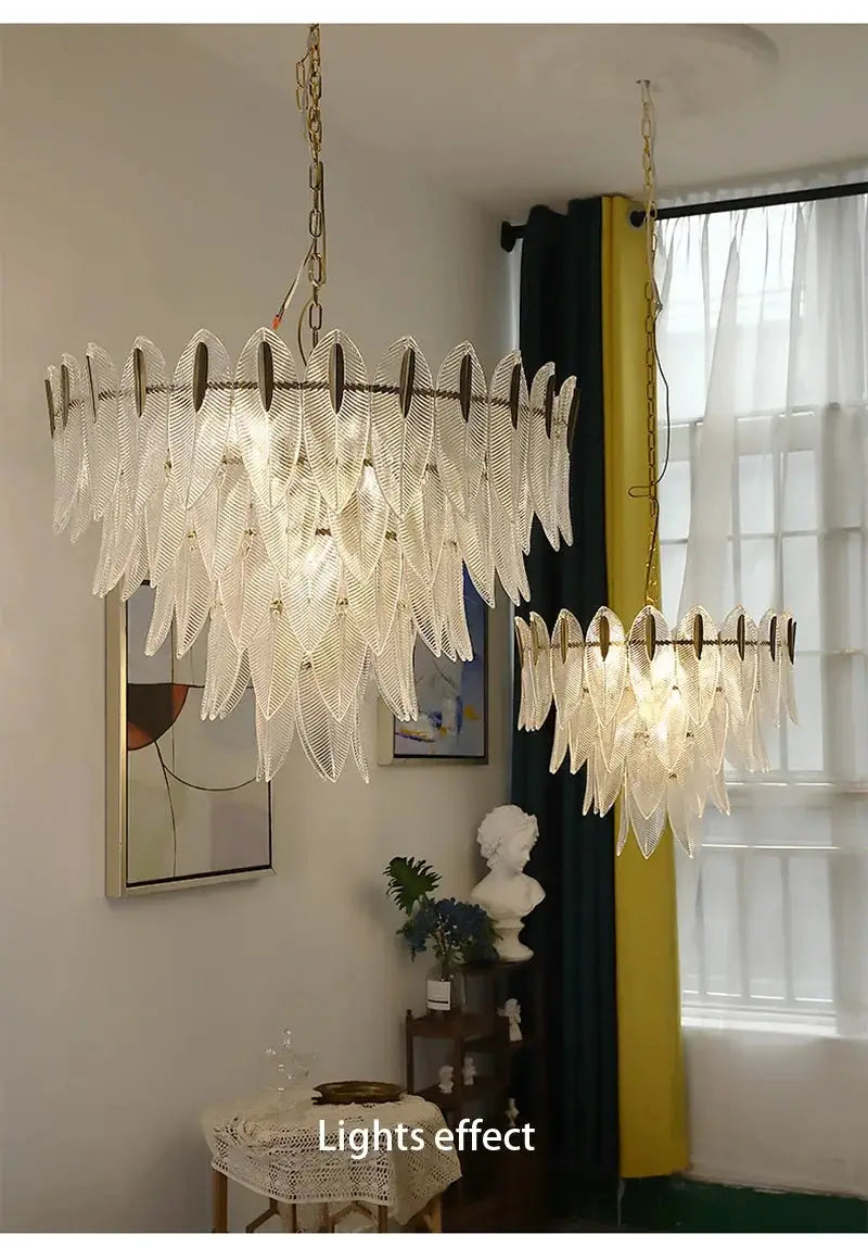French Romantic Glass Chandeliers (2) pendant lamps with clear leaf-shaped glass and gold-tone frames.