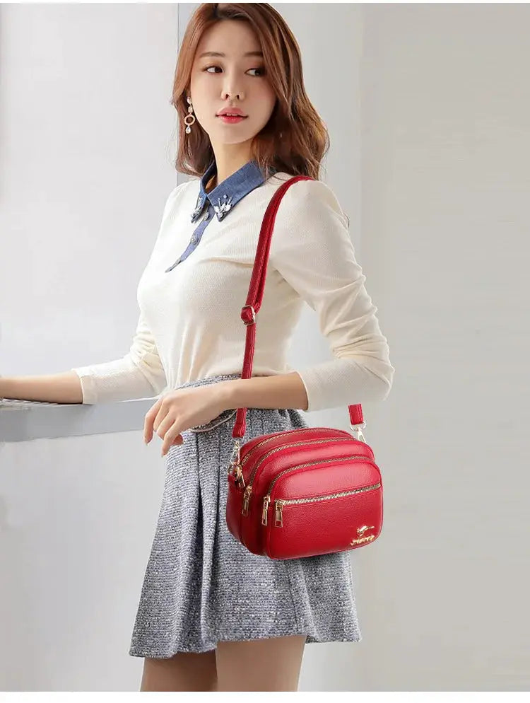 Simples Market red soft leather shoulder bag with multiple pockets and gold hardware