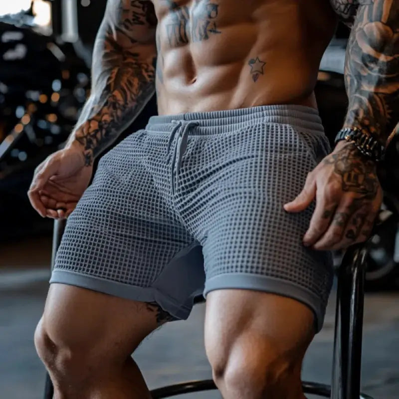 Men's oversized stretch waffle shorts in grey for gym, quick-dry fabric with elastic waistband.