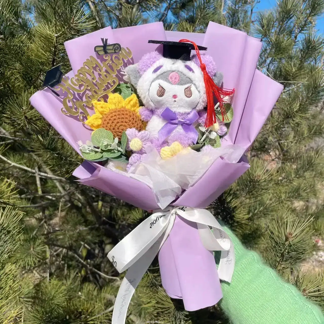 Stuffed plant bouquet with plush graduation-cap toy, sunflowers and purple flowers, lavender wrap