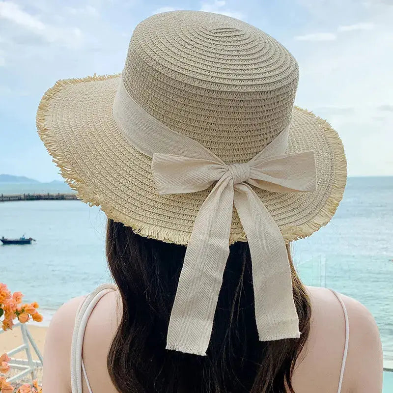 Korean Bow Straw Hat for women by Simples Market, beige wide-brim straw sun hat with fabric bow