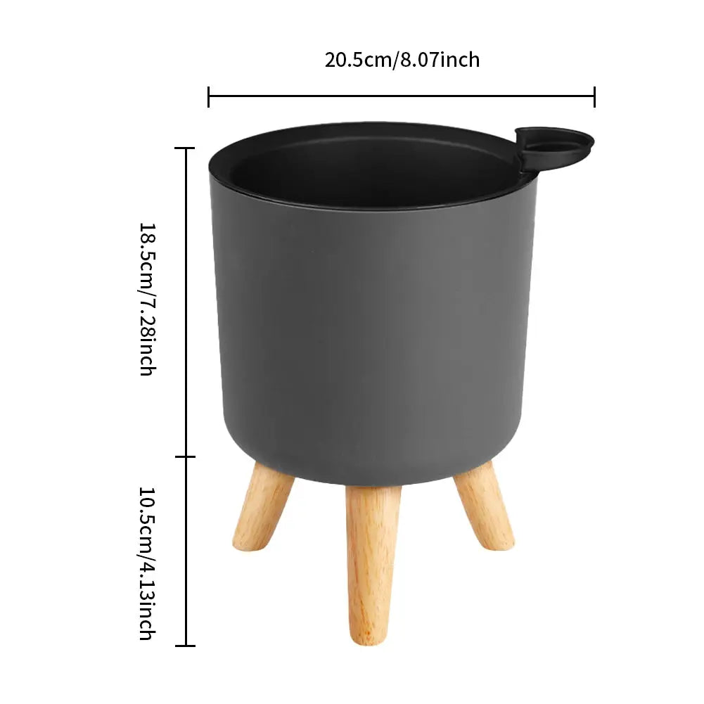 Floor-standing round plant pot with wooden legs and self-watering drainage, dark gray, Simples Market
