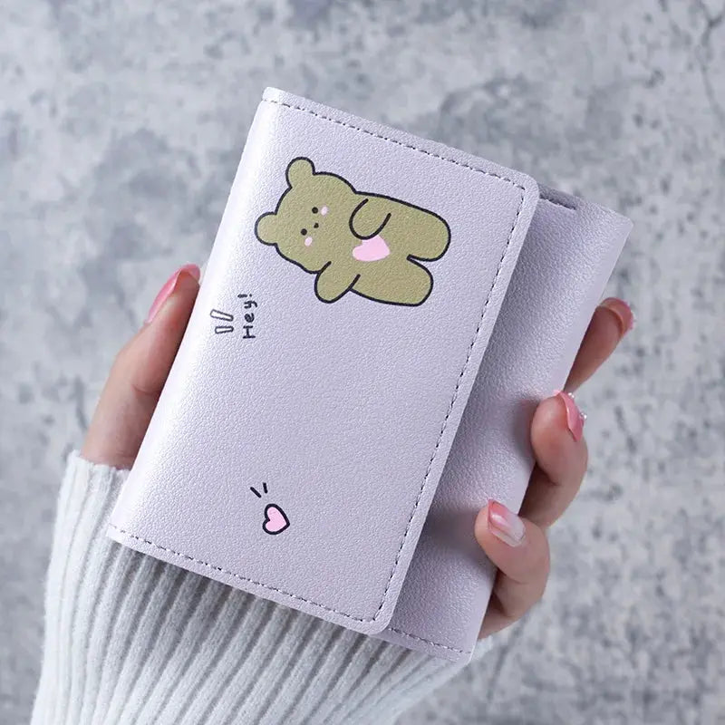 Small lavender wallet with cute cartoon bear illustration and card holder