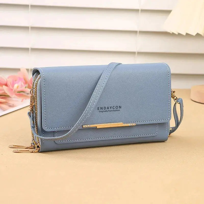 Women’s blue mid-size wallet bag with convertible shoulder strap and ENDAYCON logo