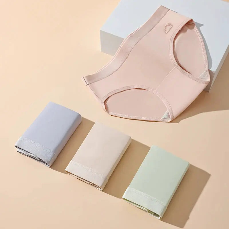 Panties set; 5 cotton, breathable low-rise briefs in pastel colors, pink pair shown with four folded hues.