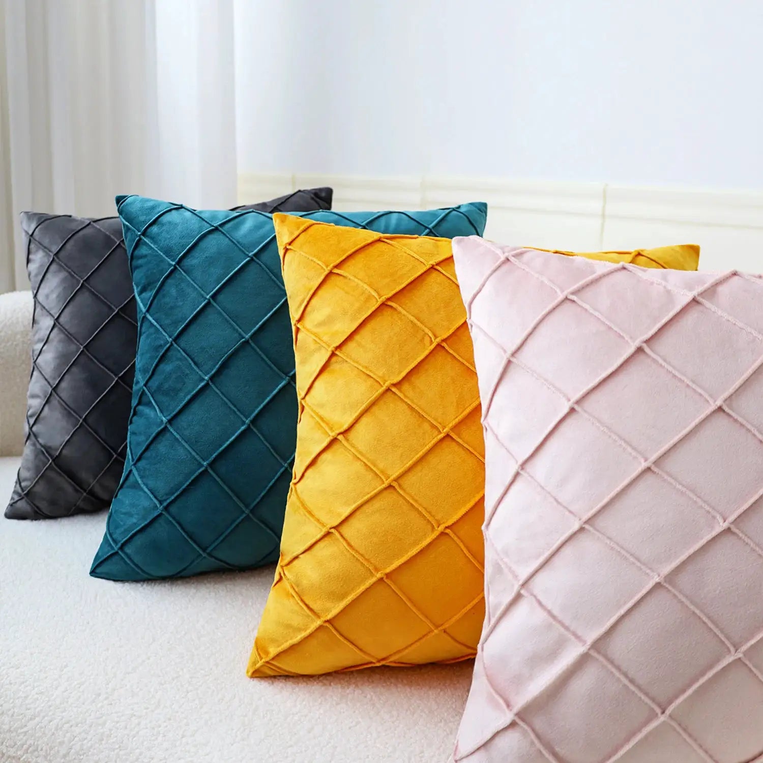 Velvet cushion covers set for sofa, 45x45cm, in gray, teal, mustard and pink with a geometric lattice pattern.