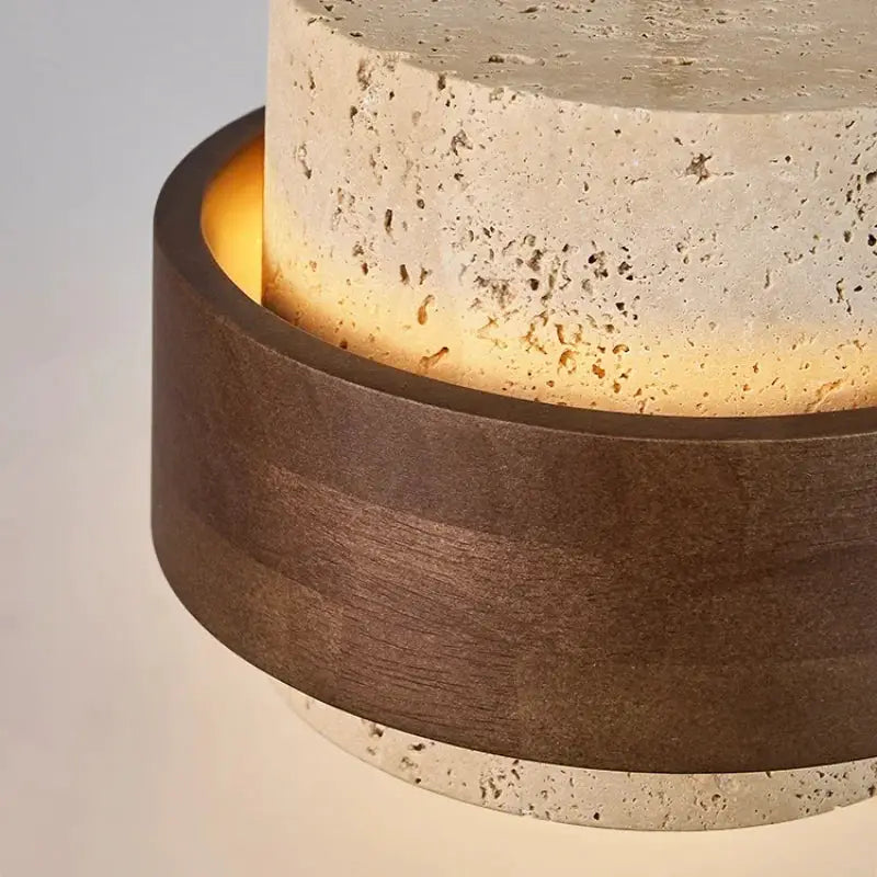 Led pendant lamp with stone cylinder and walnut wood ring, warm ambient lighting by Simples Market