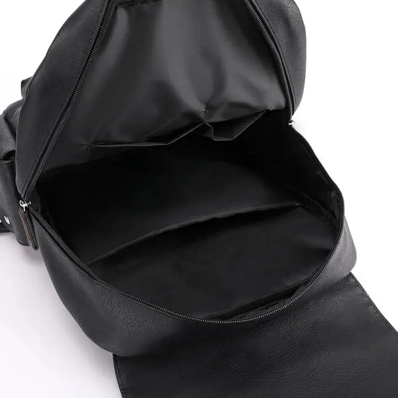 Black PU leather backpack with a large main compartment, open zipper showing roomy interior