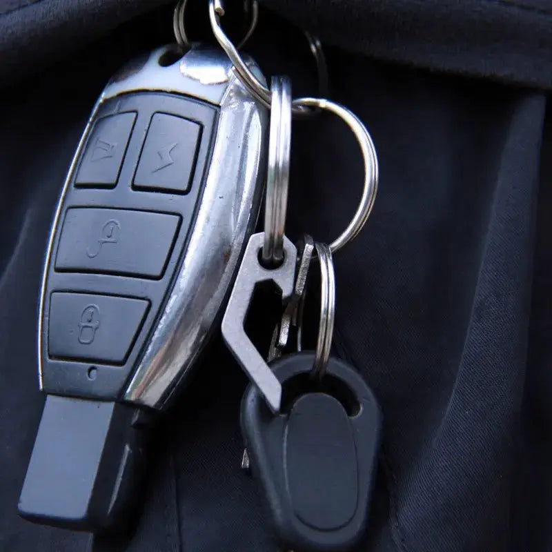 EDC Gear mini bottle opener keyring with black car remote fob and two attached tools on a silver metal ring