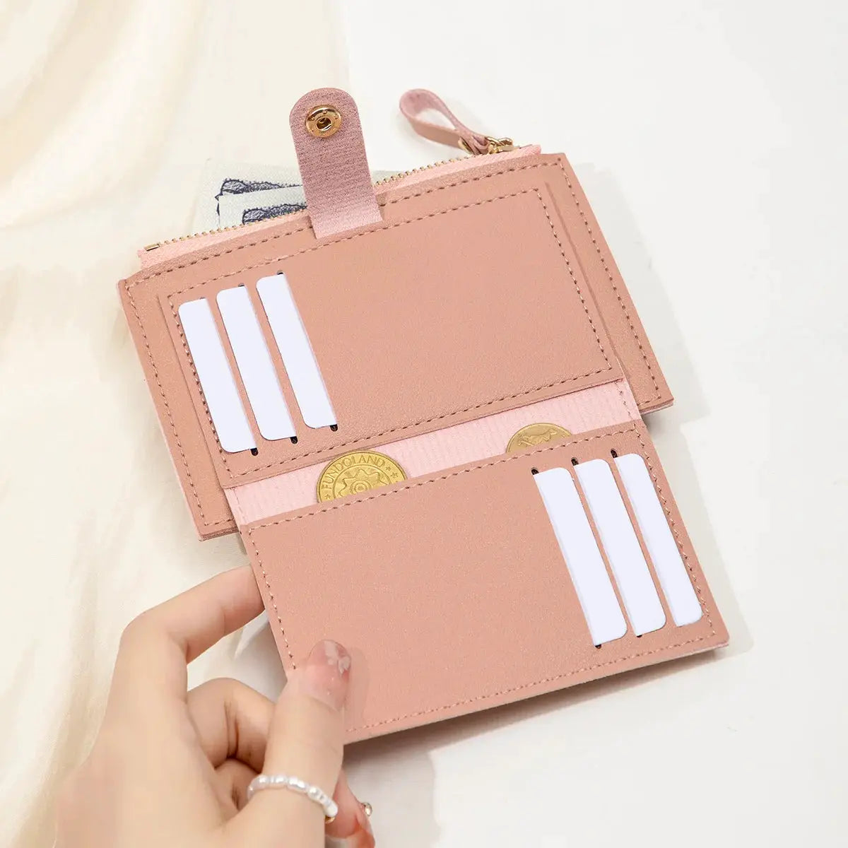 Simples Market pink minimalist card wallet with multiple card slots and snap strap in ultra-thin PU leather