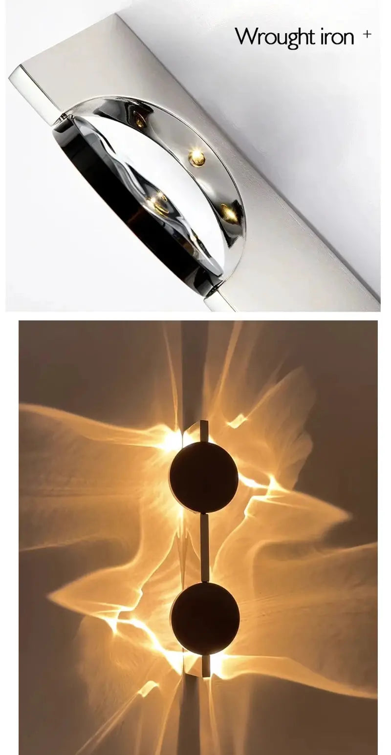LED wall light by Simples Market; rotatable stainless steel wall sconce with chrome finish and dual discs.