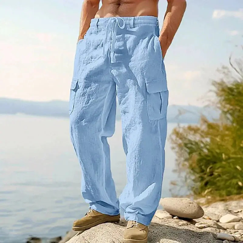 Men's light blue cargo pants by Simples Market, breathable cotton-linen, drawstring waist, loose straight leg.