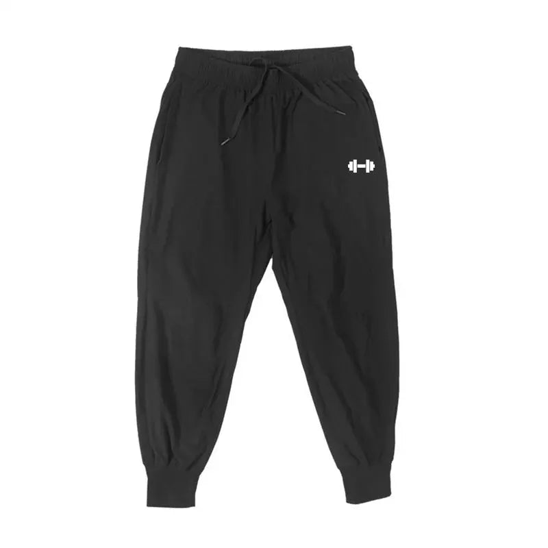 Men's black gym pants by Simples Market; lightweight, quick-dry training joggers with elastic waist
