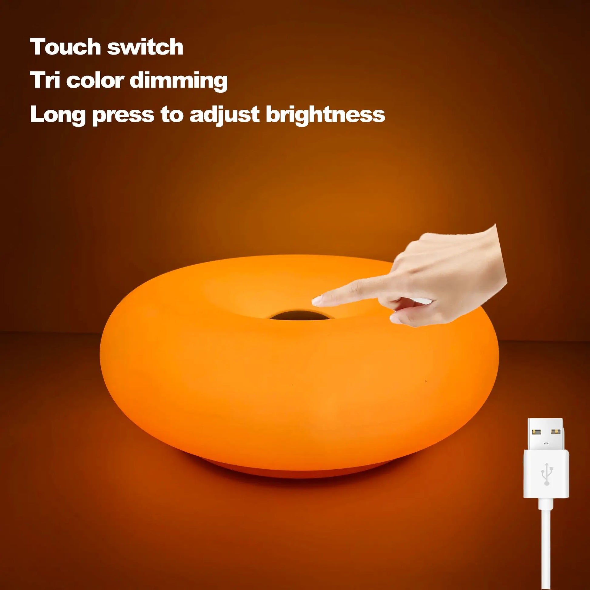 Bauhaus donut table lamp, orange, USB plug; hand touching lamp