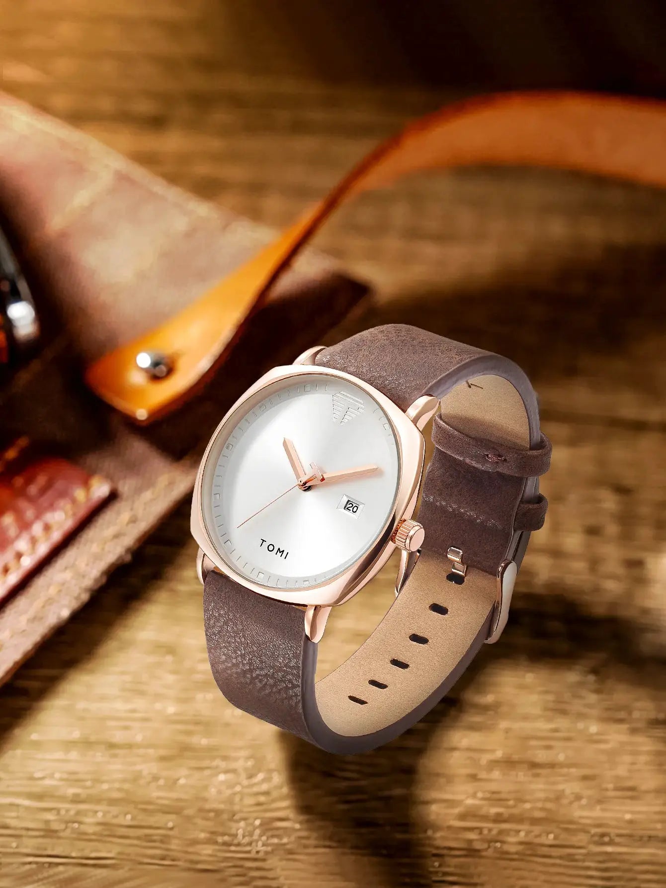 TOMI men's minimalist analog quartz watch with rose gold case, white dial, and brown leather strap.