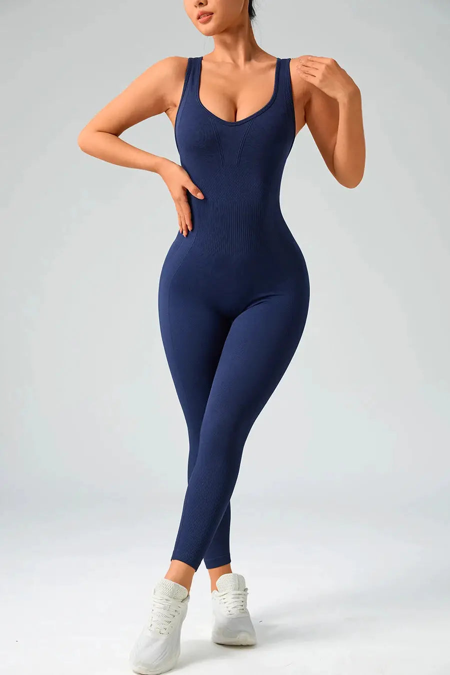 Simples Market navy blue seamless gym bodysuit for women with wide straps and ribbed waist.