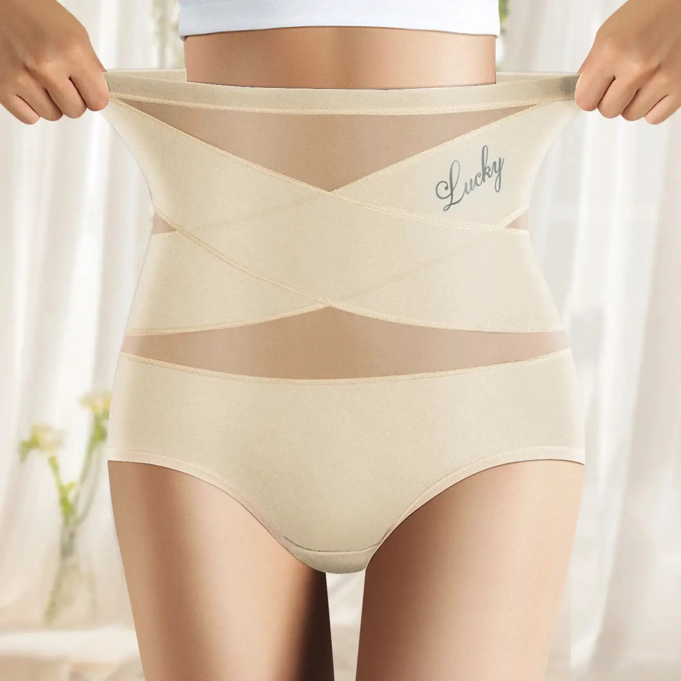 High-waisted cream shapewear panties with breathable mesh cross panels and tummy cinch, Lucky logo.