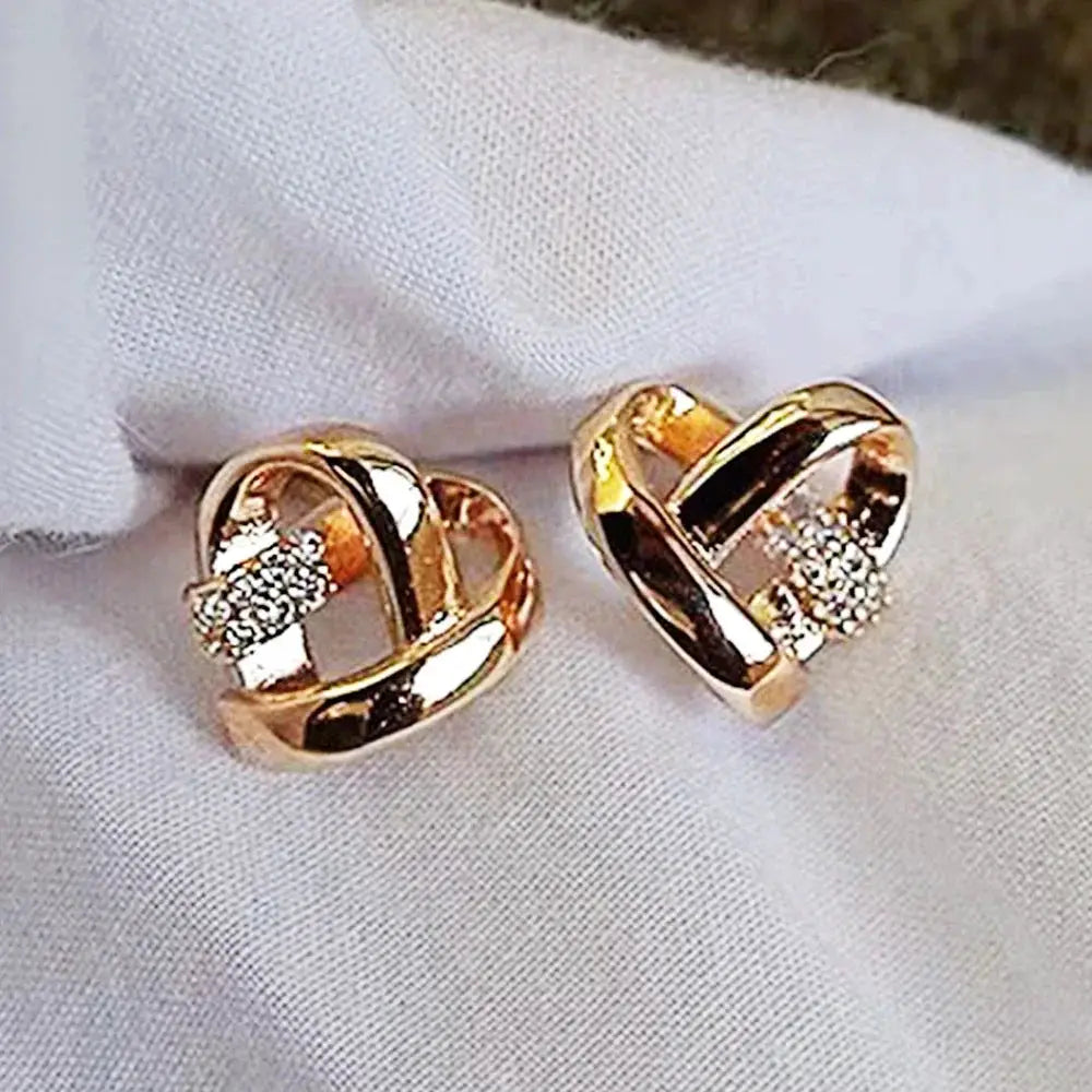 Heart-shaped stud earrings, a pair in gold-tone copper alloy with cubic zirconia accents