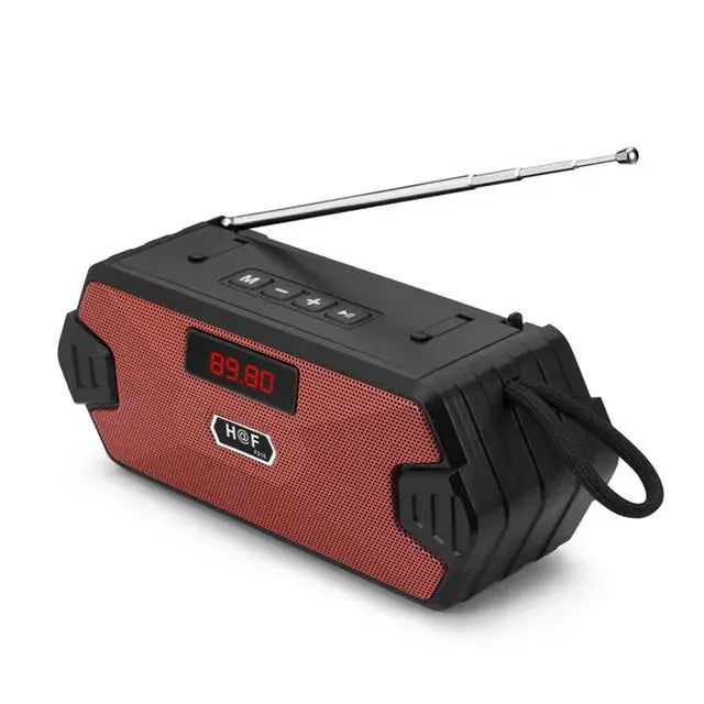 Outdoor portable speaker with red front grille, black rugged housing, LED display and extendable antenna