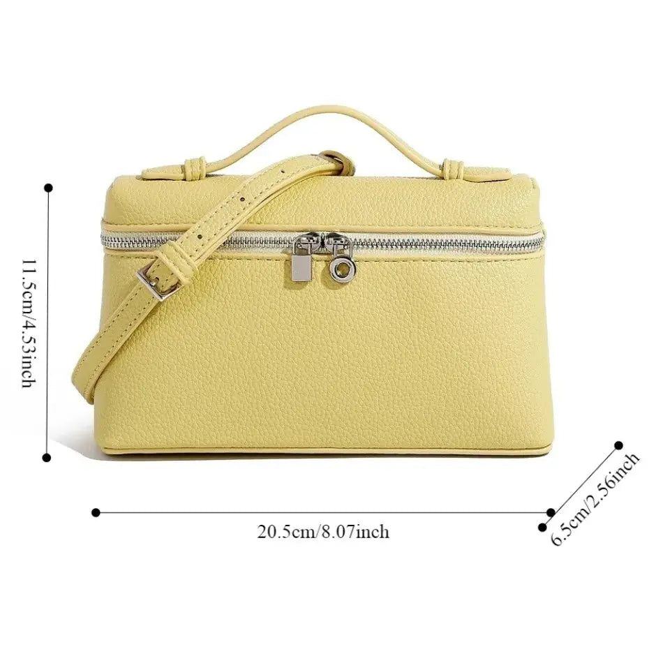 Simples Market lychee-grain mini shoulder bag in yellow with top handle and crossbody strap, lunch-box style.