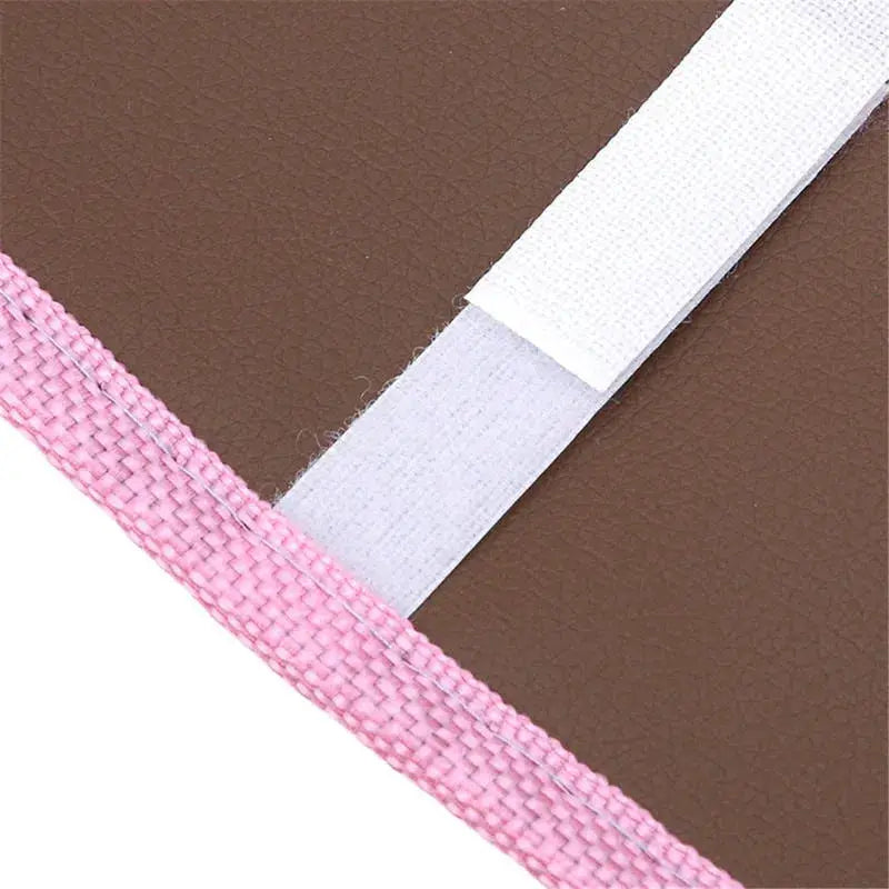 Toilet seat cover by Simples Market, plush brown with pink edge and white securing strap