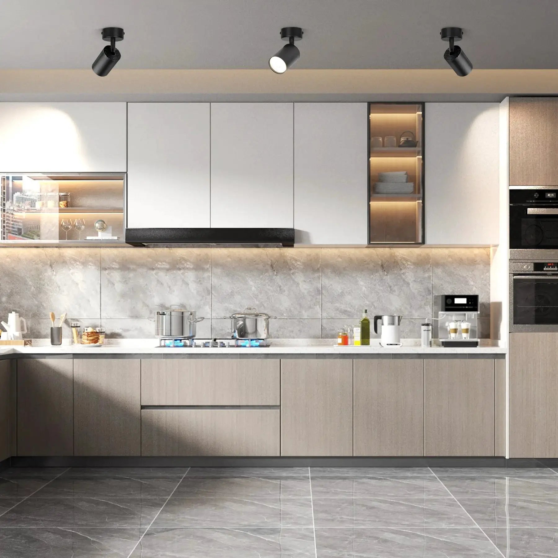 Three black LED shop ceiling spot lamps with GU10 bulbs over a modern kitchen