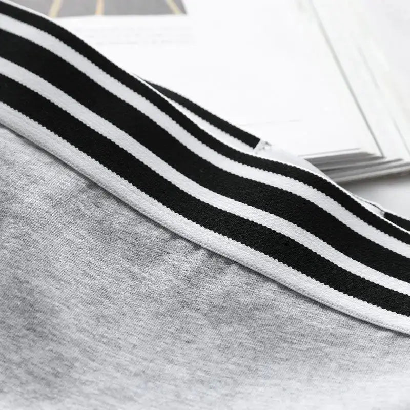 Women's low-waist boxer briefs by Simples Market with grey fabric and black-white striped elastic waistband