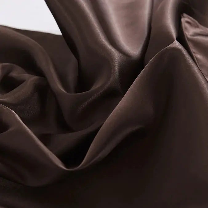 Satin pillowcase by Simples Market, solid chocolate brown cushion cover with a glossy finish.