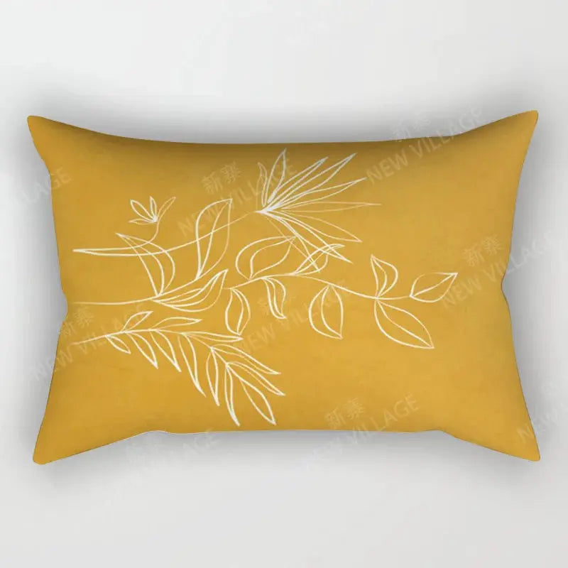 Throw pillow cover in mustard yellow with white abstract leaf pattern.