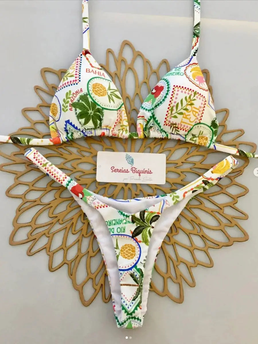 Micro bikini set, tropical multicolor print; white halter top and thong bottoms, two-piece, tag reads Sereias Biquínis.