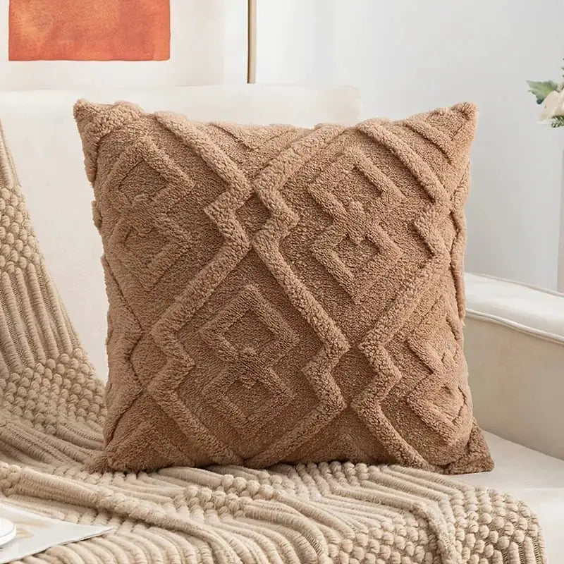 Throw pillow cover by Simples Market; plush tan cushion with geometric diamond pattern.