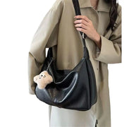 Trendy slouchy shoulder bag, black PU leather with teddy bear charm, large-capacity tote
