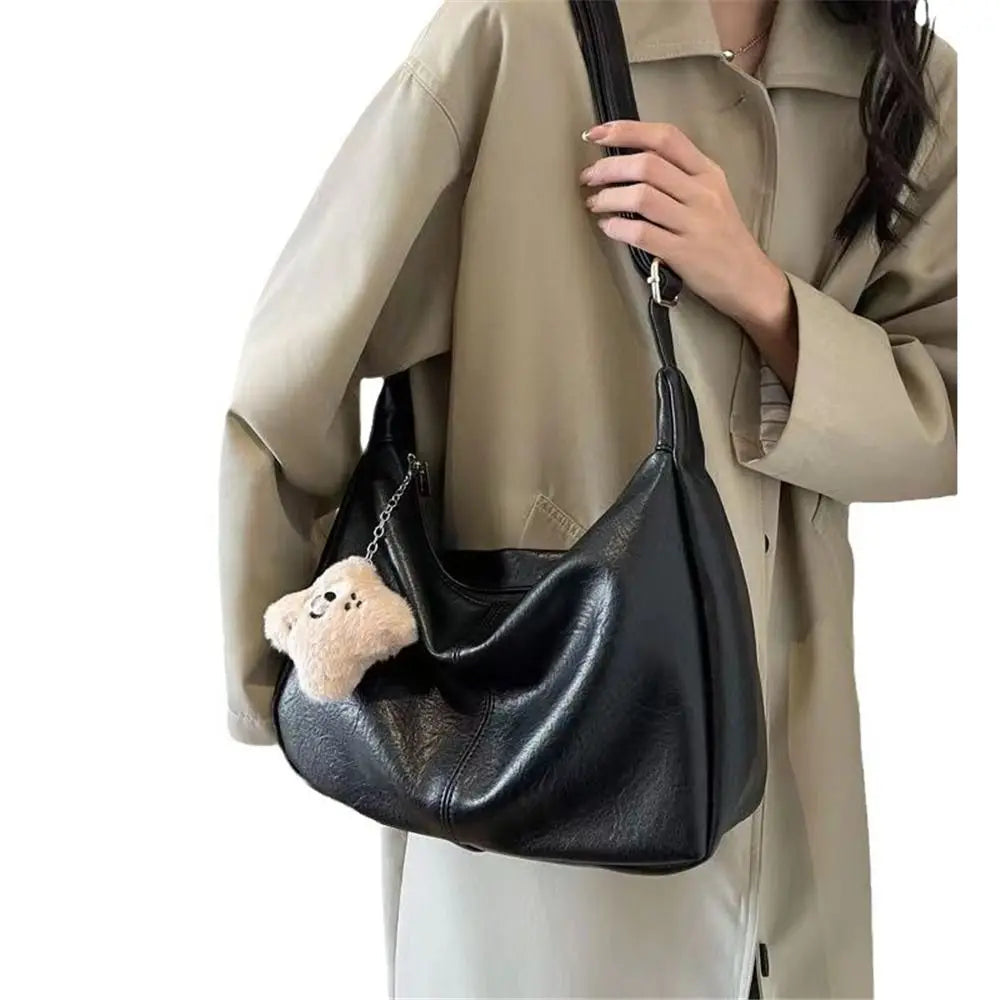 Trendy slouchy shoulder bag, black PU leather with teddy bear charm, large-capacity tote