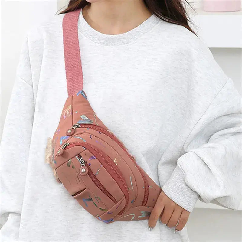 Women's peach waist bag with pink strap, zip pockets, crossbody fanny pack style