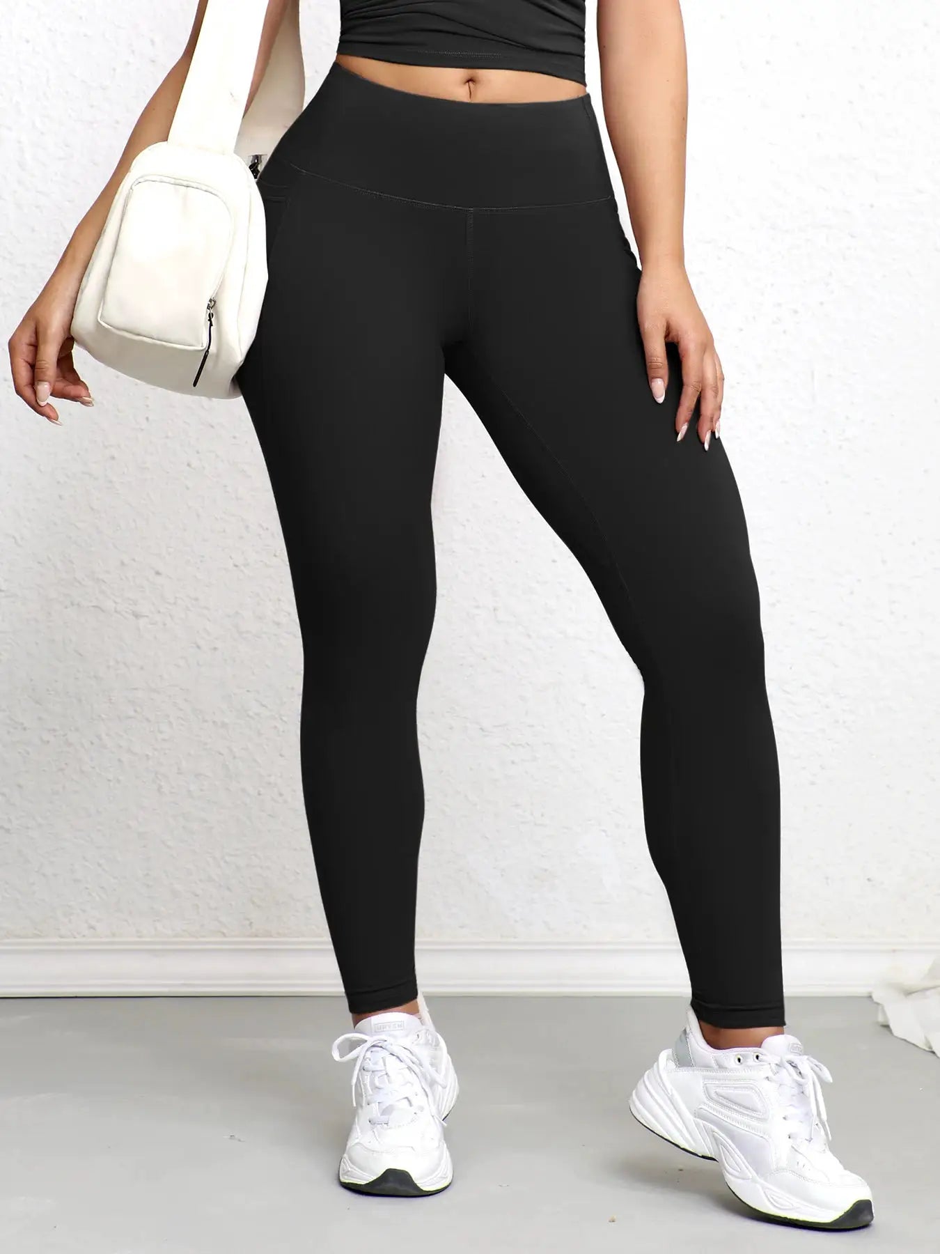Women leggings with pockets by Simples Market; solid black, high-waisted, butt-lifting workout tights