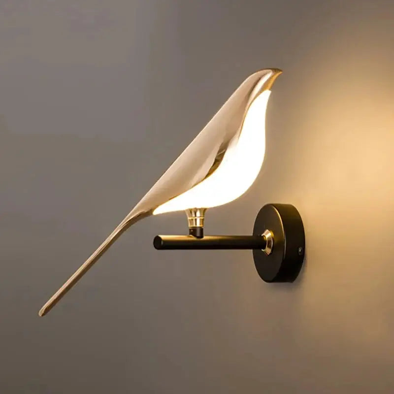 Modern LED wall lamp with magpie bird design; white bird-shaped shade on black metal wall mount.
