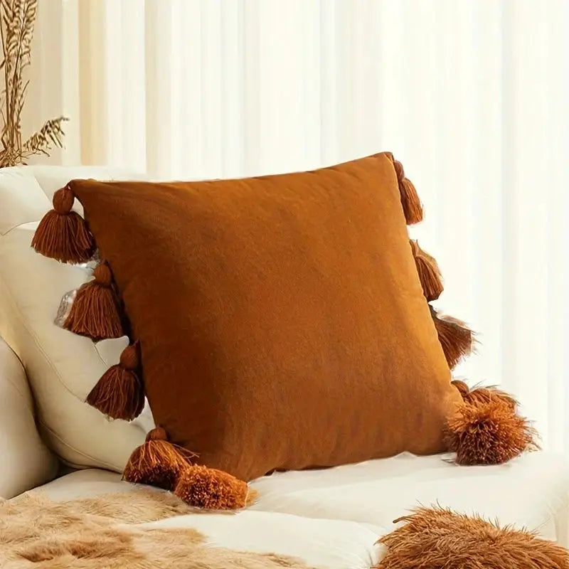 Throw pillow cover with tassels in burnt orange for Boho couch decor
