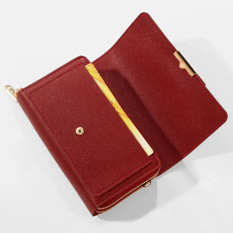 Women's red wallet handbag with multiple card slots, gold hardware and chain strap