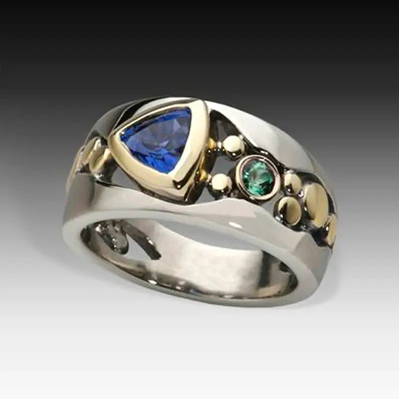 Huitan two-tone triangular blue CZ ring for women with a green accent stone on a silver and gold-tone band