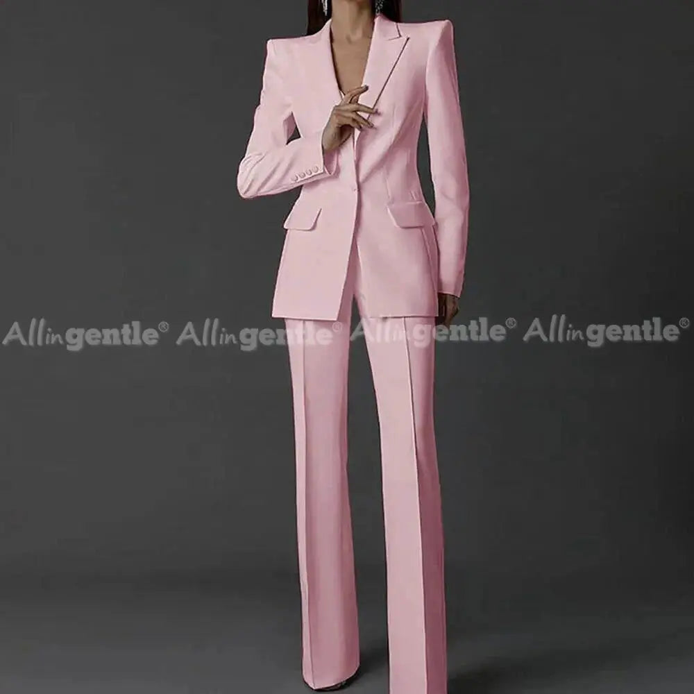 Pink women's pantsuit set with long-sleeve single-button blazer and wide-leg pants; party-ready, Simples Market.