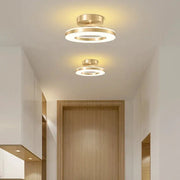 Two ring LED ceiling lights by Simples Market, gold and white circular ceiling lamps for warm home decor.