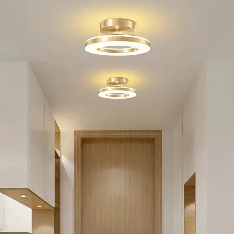 Modern LED ceiling lamp set of two by Simples Market; gold circular ring fixtures with warm illumination.