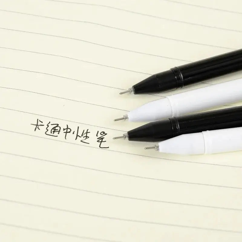 Kawaii cat gel signature pens, 3 pens with black and white barrels on a lined notebook