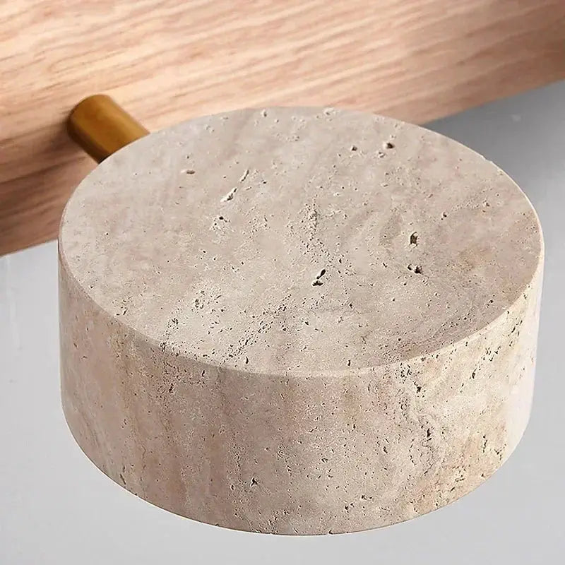 Round LED wall light by Simples Market in beige stone finish with a wooden stem