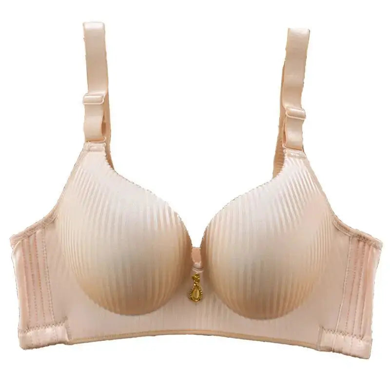 Simples Market beige wire-free push-up bra with ribbed padded cups, adjustable straps, and a gold pendant between cups