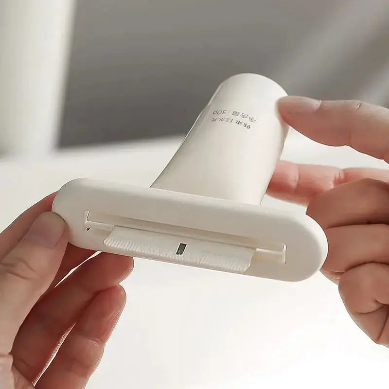 Toothpaste squeezer by Simples Market, white handheld roller with clip for dispensing toothpaste